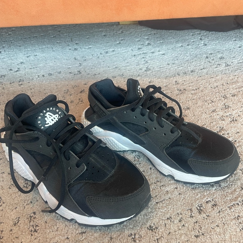 Nike Air Huarache Run sneaker in an all-black colorway Black and White Sneakers